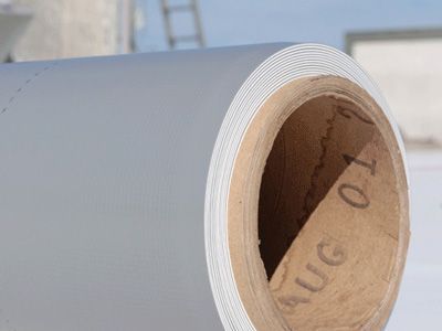 A close-up of a roll of PVC roofing materials