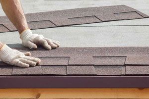 A row of metal tiles on a roof.