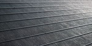 A row of rubber tiles on a roof.