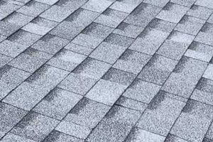 A close-up of a roof with a lot of shingles on it.