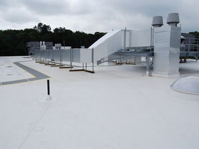 A roof with white TPO roofing meterials 