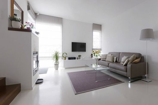 Living room with leather sofa and glass table