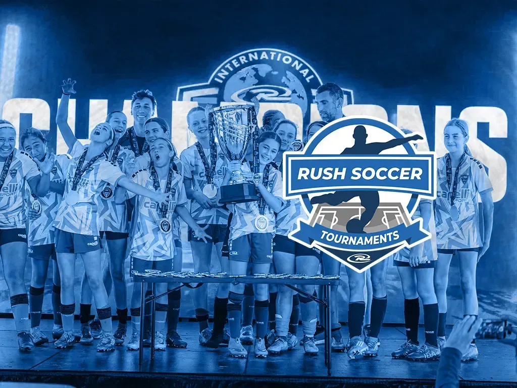 Youth soccer teams celebrating with trophies at Rush Soccer Tournaments podium