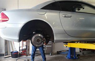 Car Repair — Mechanic Repairing Car in Tavares, FL