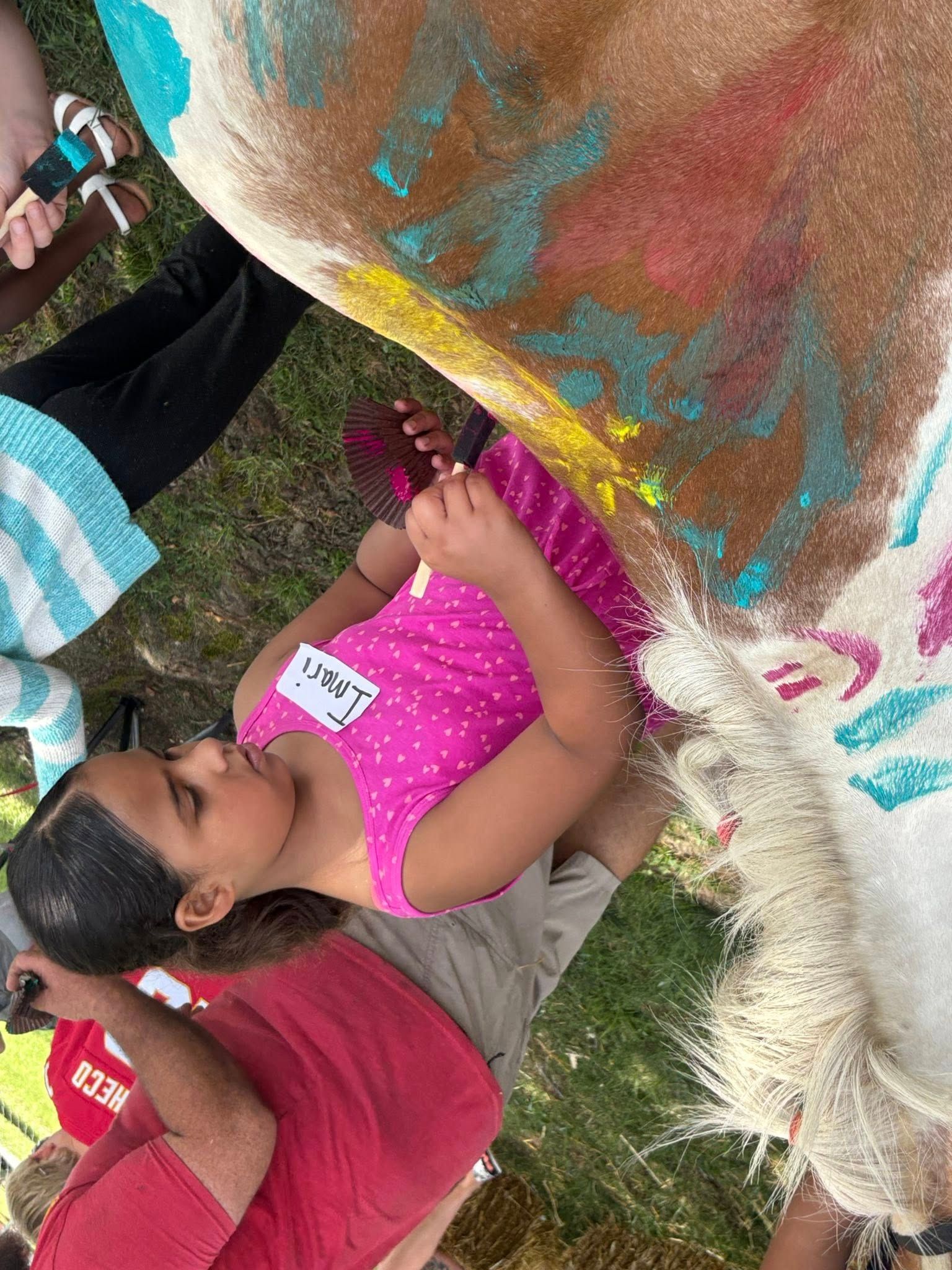 Girl painting horse for outreach Farmyard Fellowship