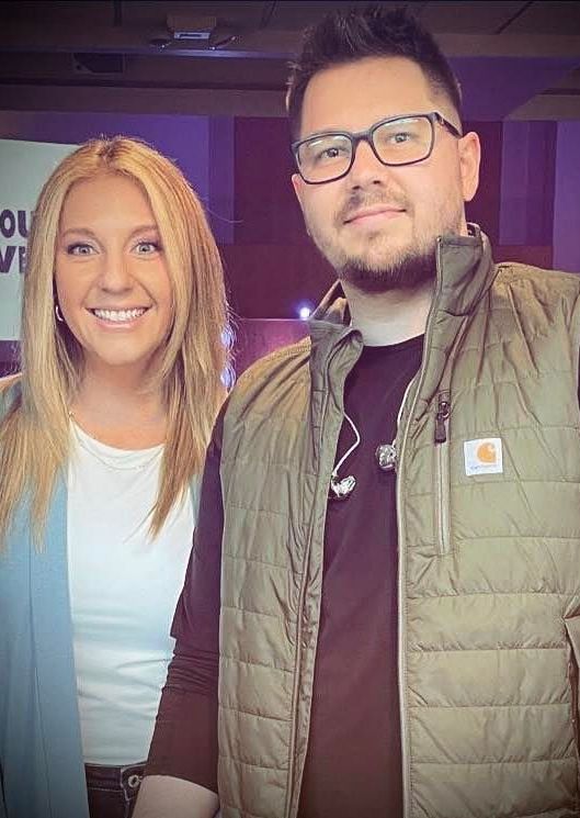 A man and a woman are posing for a picture together.