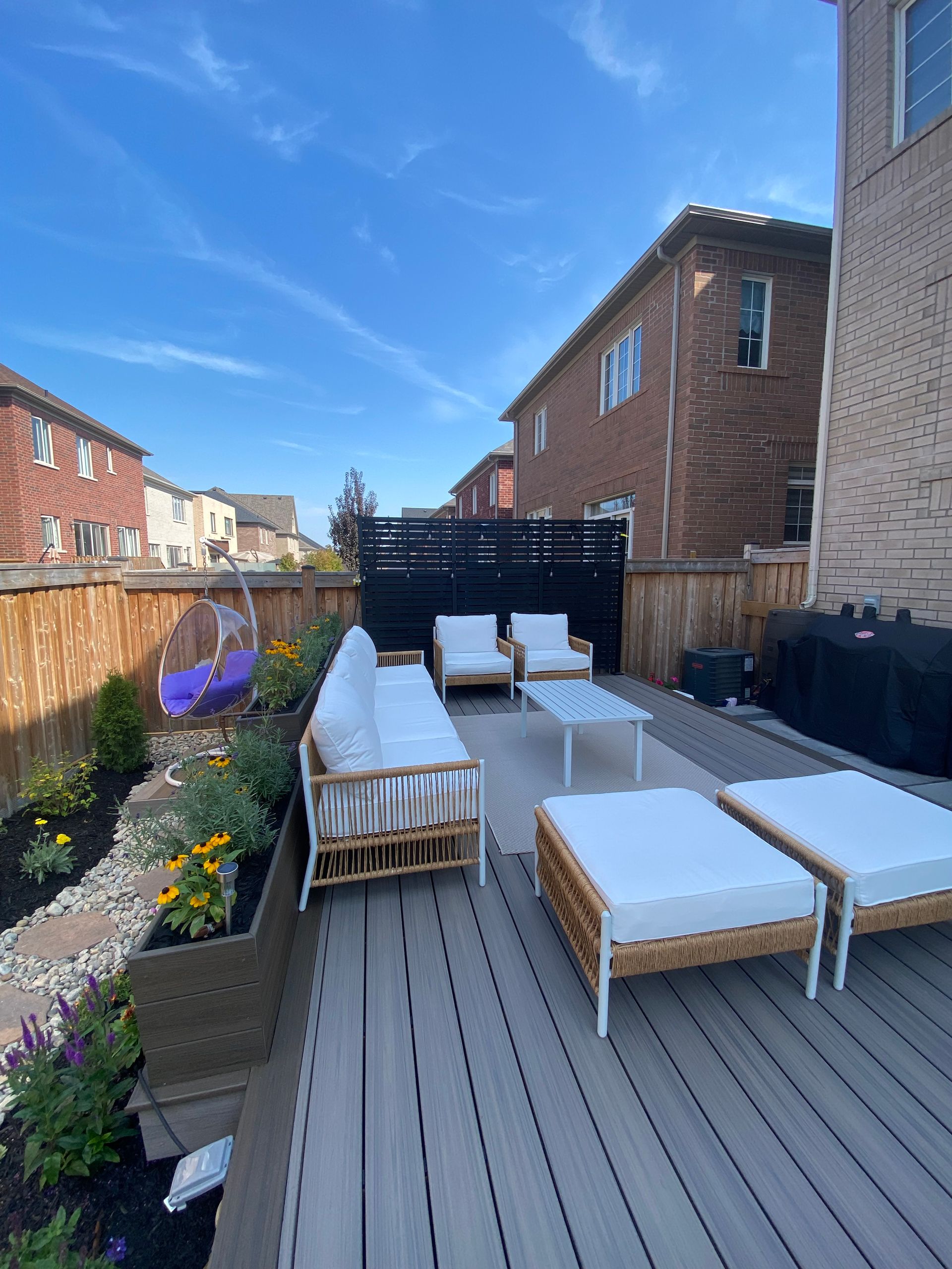 A deck with a lot of furniture on it