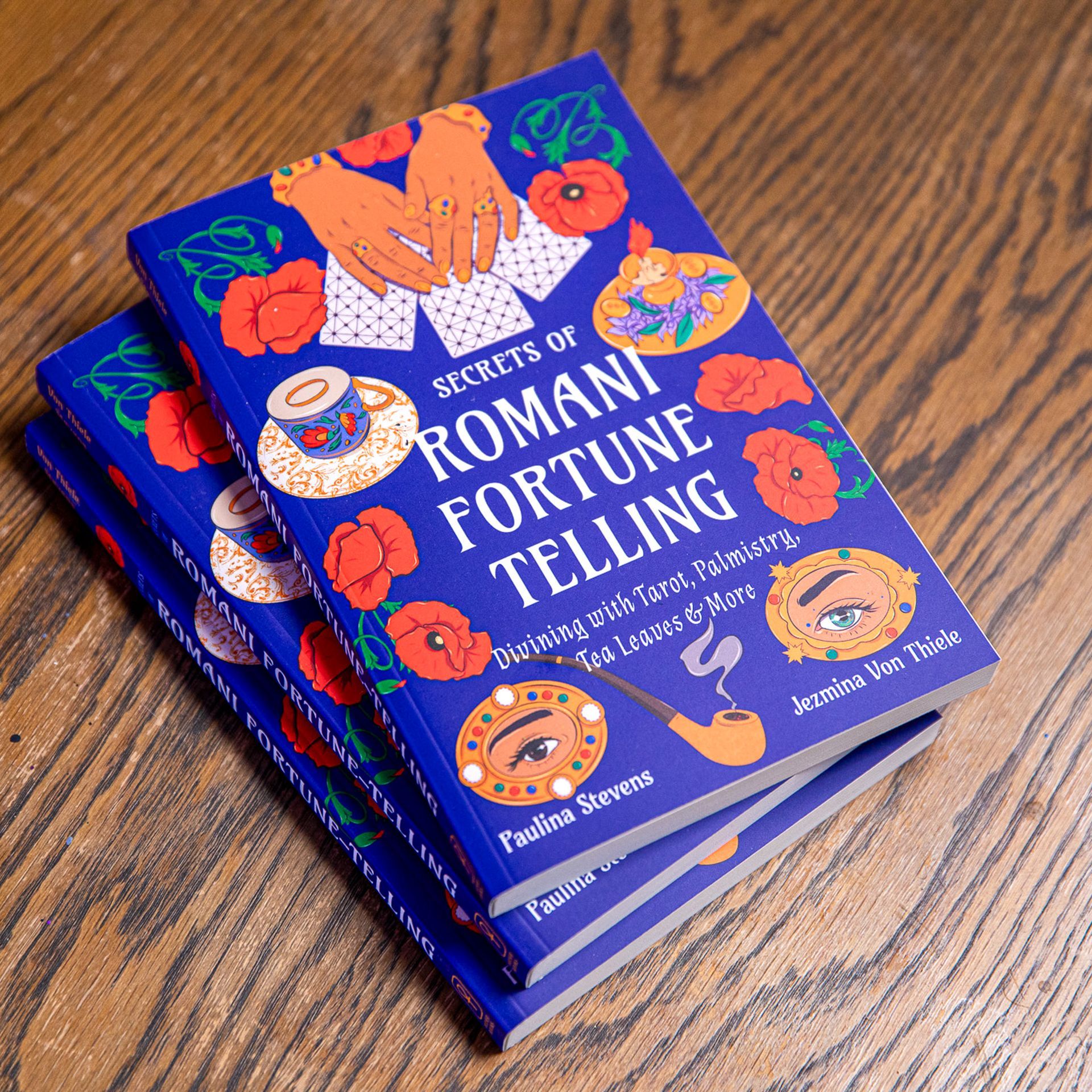 A stack of books titled secrets of roman fortune telling