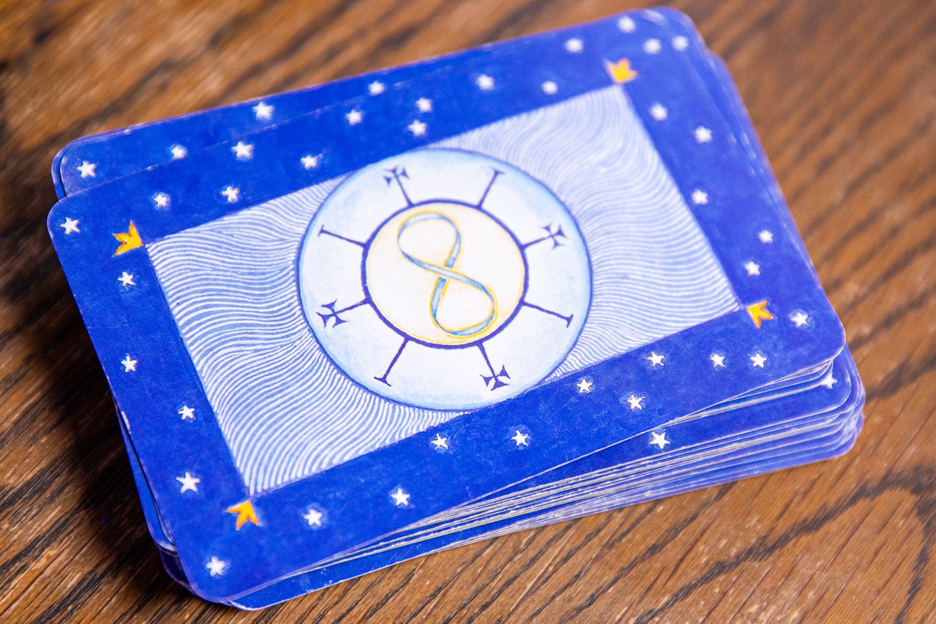 A stack of tarot cards with the number 8 on them