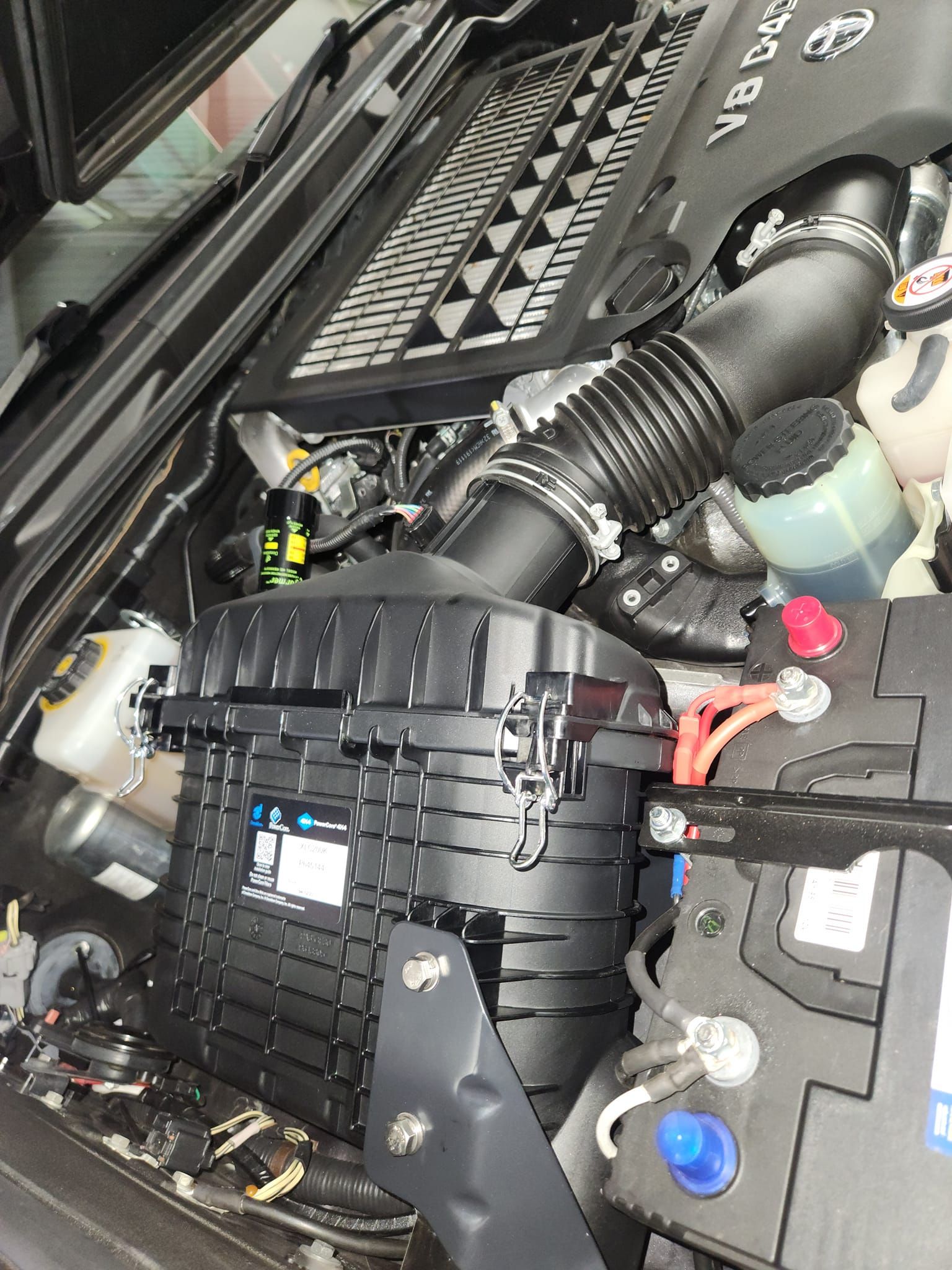 A close up of the engine of a car.