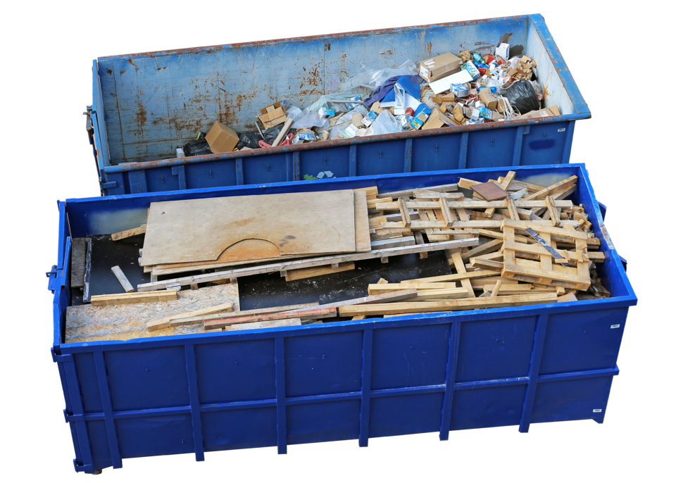 Two blue dumpsters filled with wood and tras.