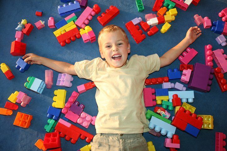 Happy kid with lego blocks