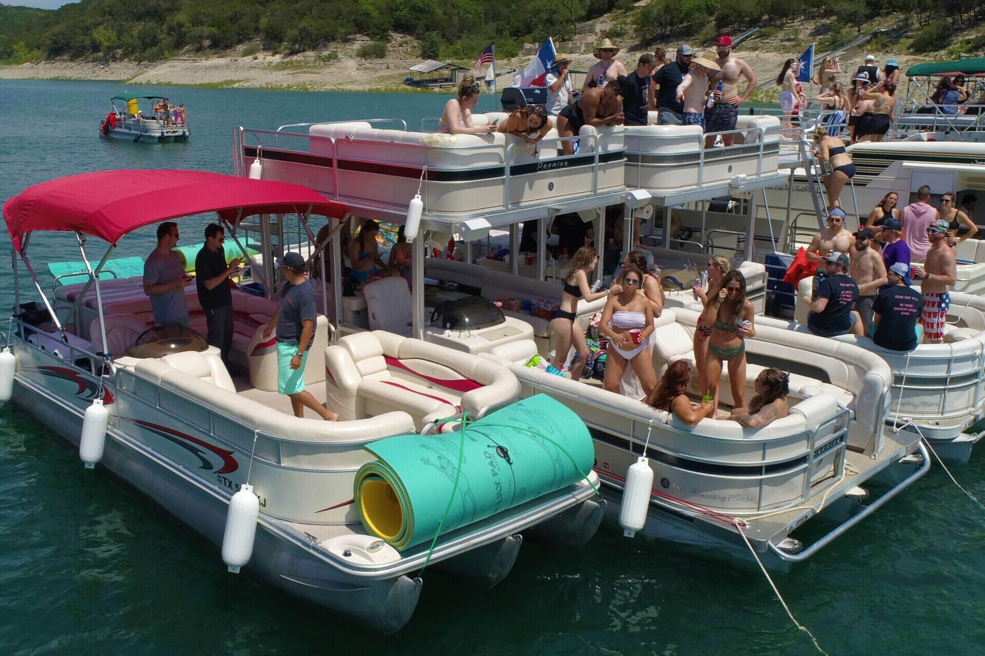 Party boats at Devil's Cove on Lake Travis in Austin, Texas.