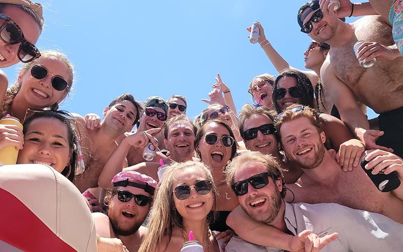 Group of friends having fun on a party boat on Lake Travis in Austin, Texas.