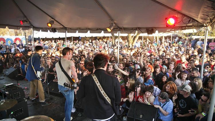 a large crowd watching a band play live at Hotel Vegas in Austin, Texas