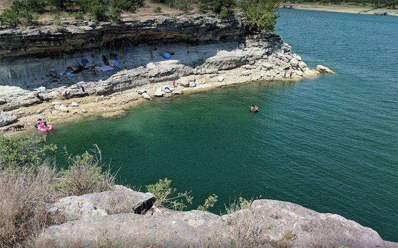 People swimming together at Pace Bend Park in Texas