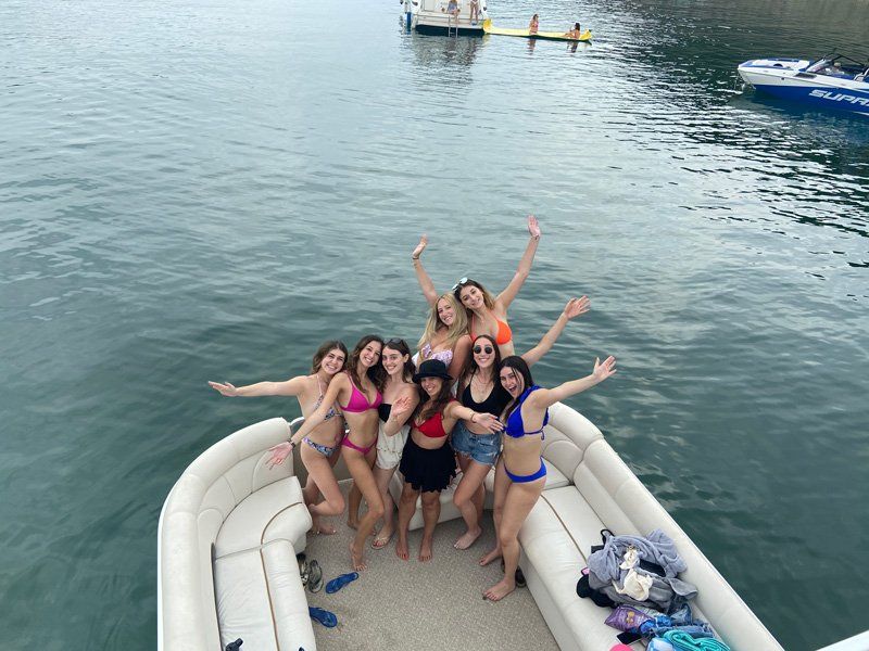 Small group of friends having a small boat party on Lake Travis