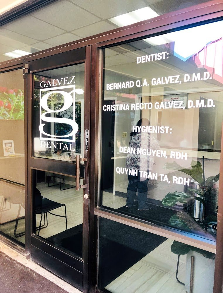 An aerial view of a city skyline at sunset.