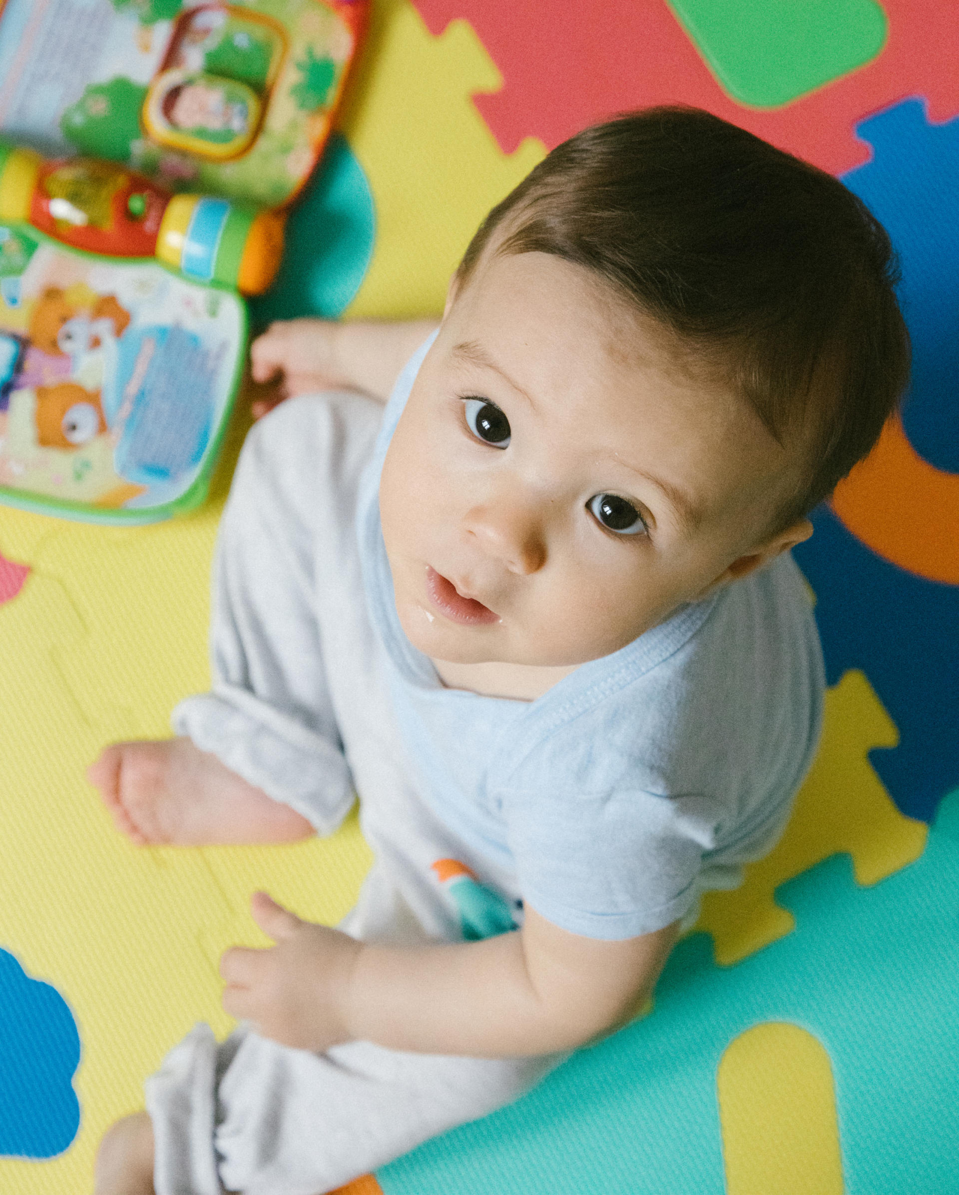 Child looking up from floor