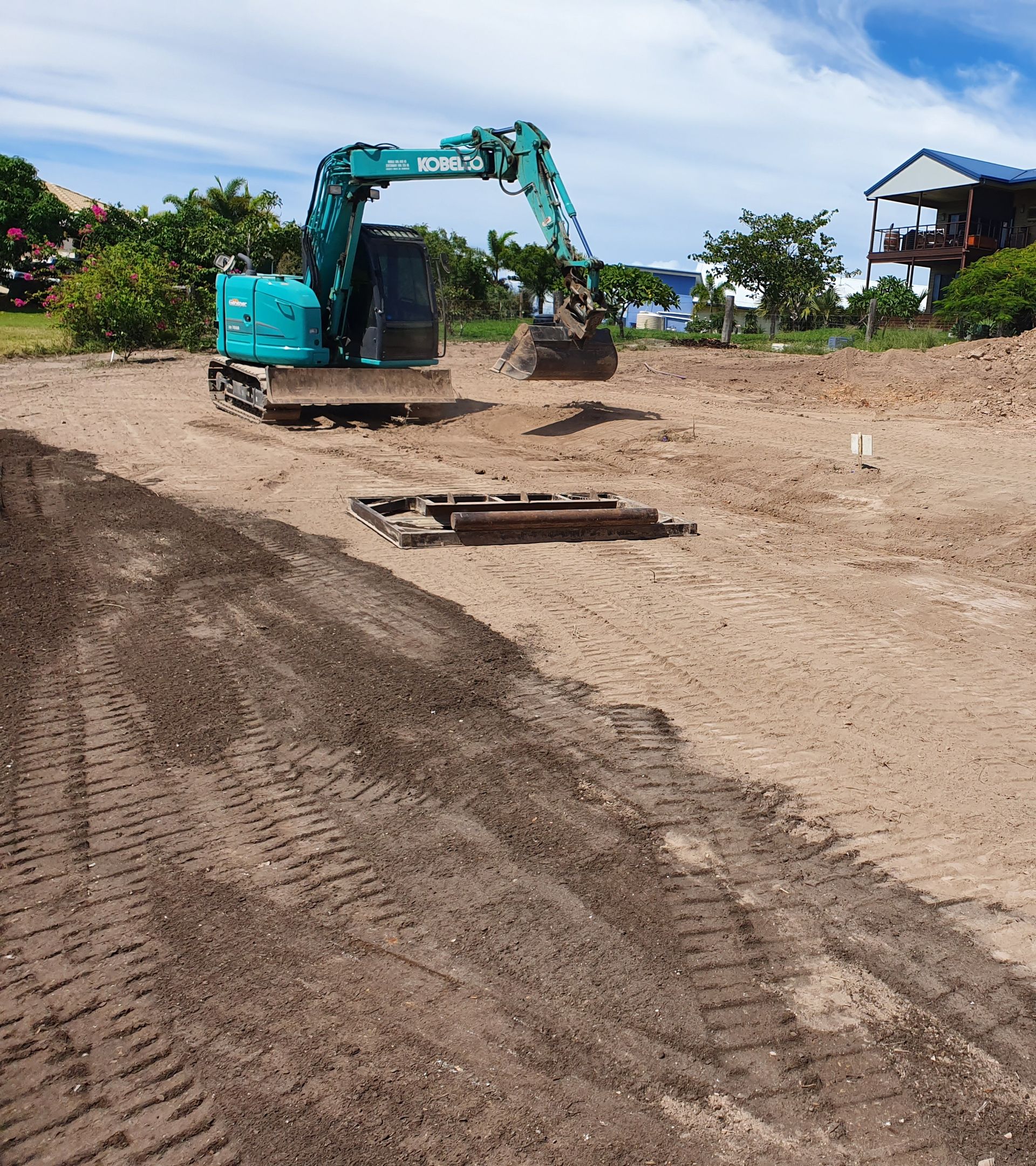 Excavator on a Construction Site, Scooping Dirt — Snell Earthworx In Hervey Bay, QLD