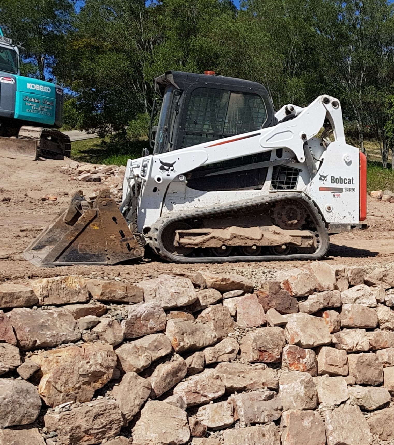 White Bobcat Skid-steer Loader on a Construction Site — Snell Earthworx In Hervey Bay, QLD