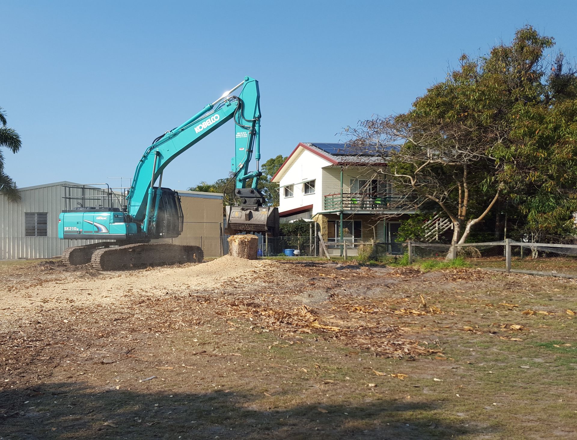An Excavator Demolishes a House — Snell Earthworx In Craignish, QLD