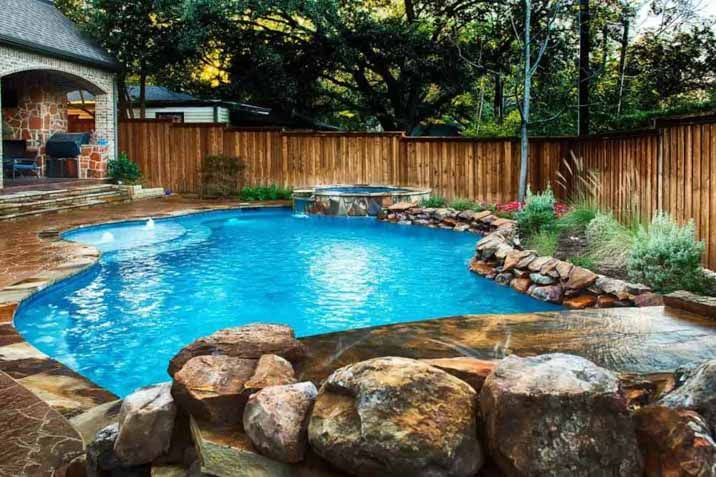 Backyard Pool with Rock Waterfall — Snell Earthworx In Craignish, QLD