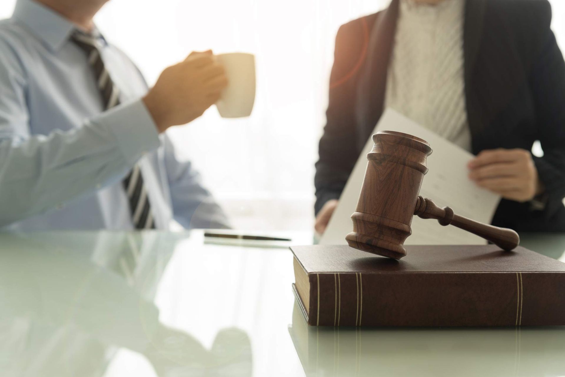 Personal injury lawyer consulting client closely during legal discussion in office.