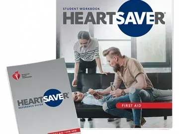Two Heartsaver first aid guides: student workbook and reference guide. The guides show people giving aid to a person on a couch.