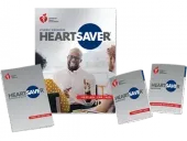 Heartsaver first aid, CPR, and AED training materials, including a student information book and smaller handbooks.