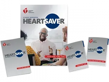 Heartsaver first aid, CPR, and AED training materials, including a student information book and smaller handbooks.