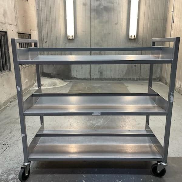 A Stainless Steel Cart Is Sitting — Border Security Doors & Powder Coating in Wodonga, VIC