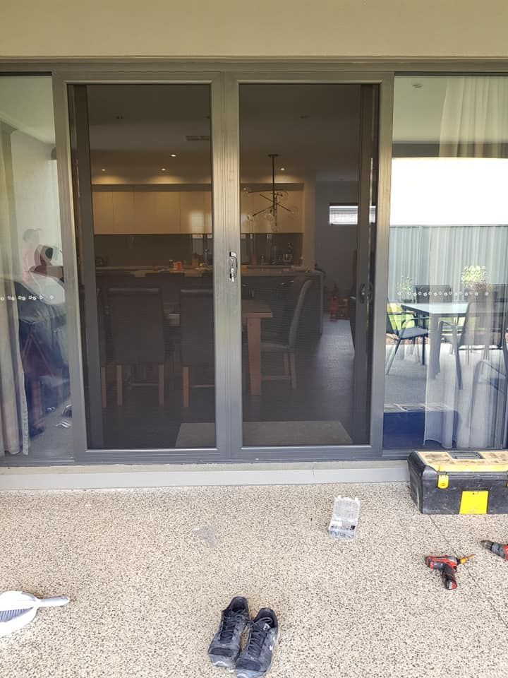 A Pair Of Shoes Are Sitting On The Ground — Border Security Doors & Powder Coating in Wodonga, VIC