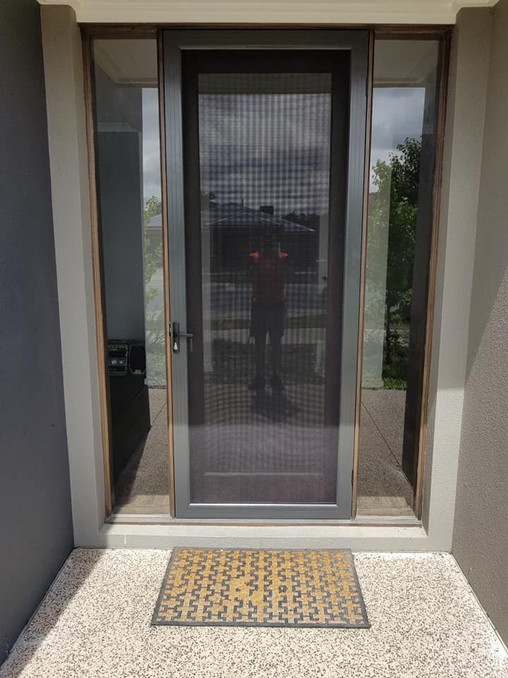 A Front Door With A Screen Door — Border Security Doors & Powder Coating in Wodonga, VIC