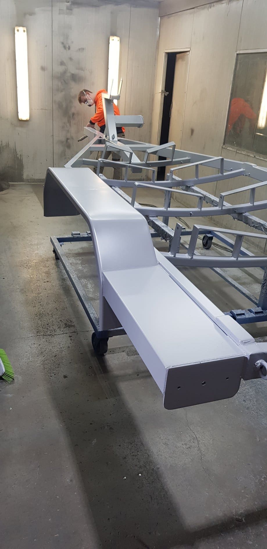 In A Room, A Man Is Working On A Piece Of Metal — Border Security Doors & Powder Coating in Wodonga, VIC