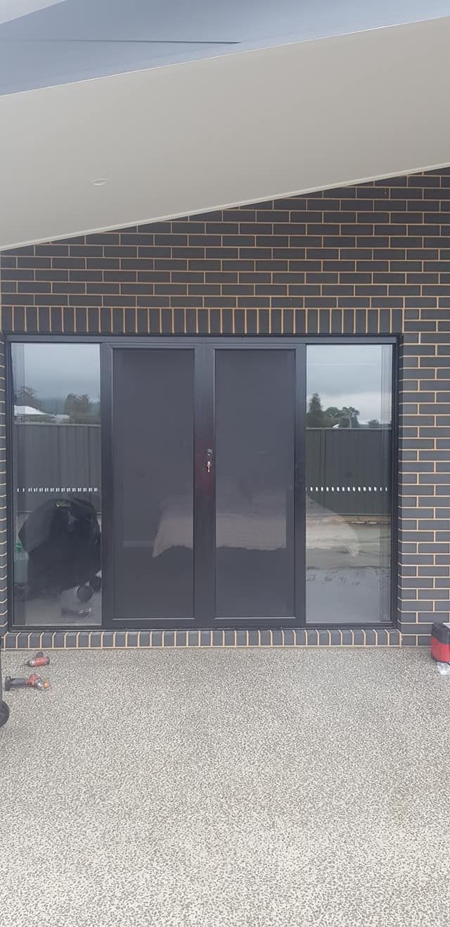 A Black Sliding Glass Door — Border Security Doors & Powder Coating in Wodonga, VIC