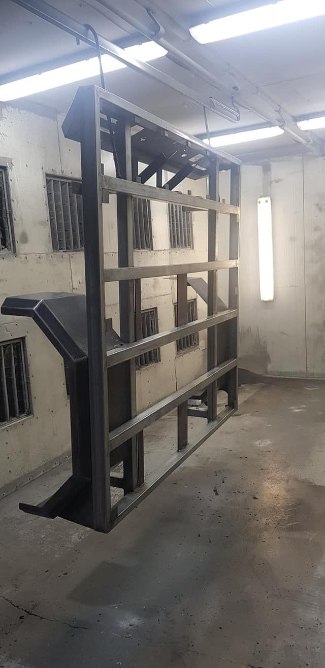 Large Metal Structure In The Middle Of A Room — Border Security Doors & Powder Coating in Wodonga, VIC