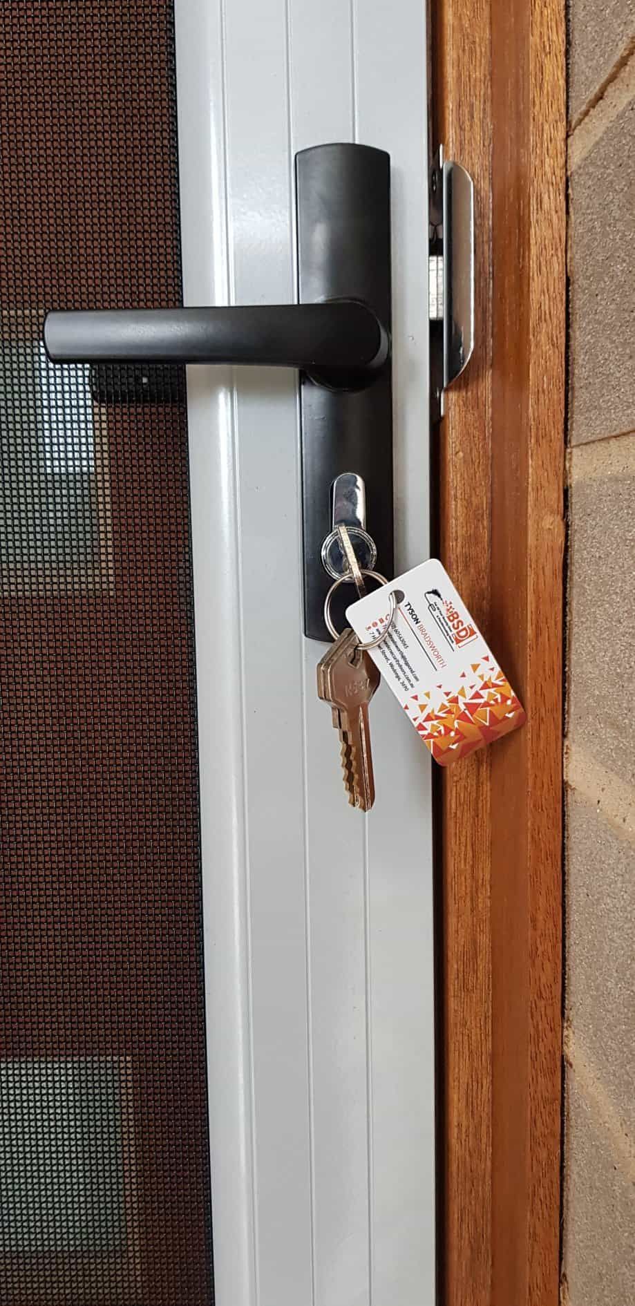 A Close Up Of A Door With A Key On It — Border Security Doors & Powder Coating in Wodonga, VIC