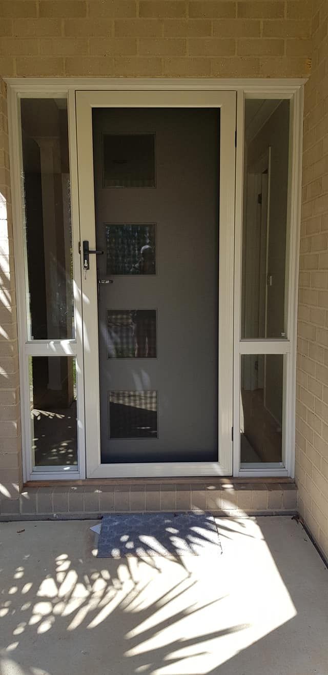 A White Door With A Screen On — Border Security Doors & Powder Coating in Wodonga, VIC