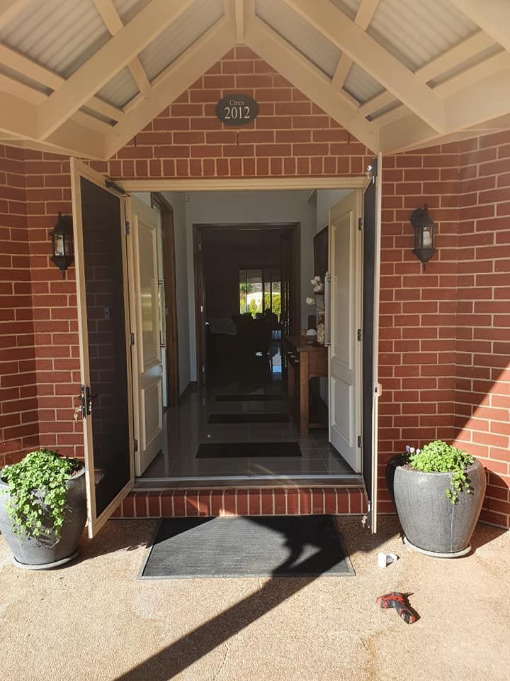 The Front Door Of A Brick House — Border Security Doors & Powder Coating in Wodonga, VIC