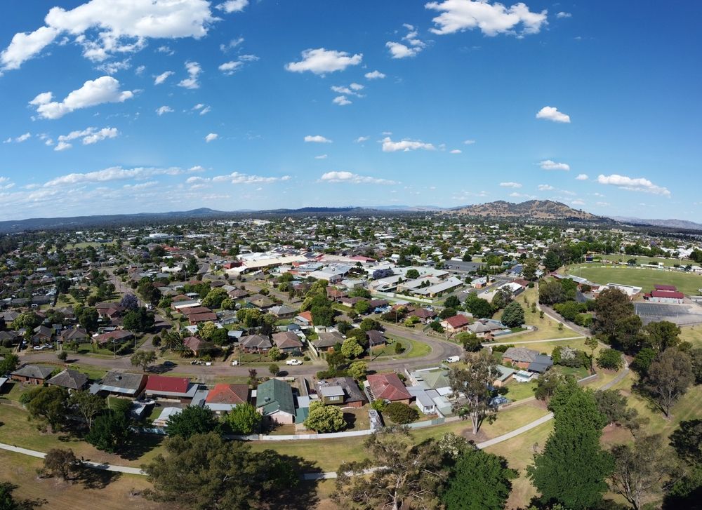 Cityscape Framed by Lush Trees in Wide View in Wodonga — Border Security Doors & Powder Coating in Wodonga, VIC