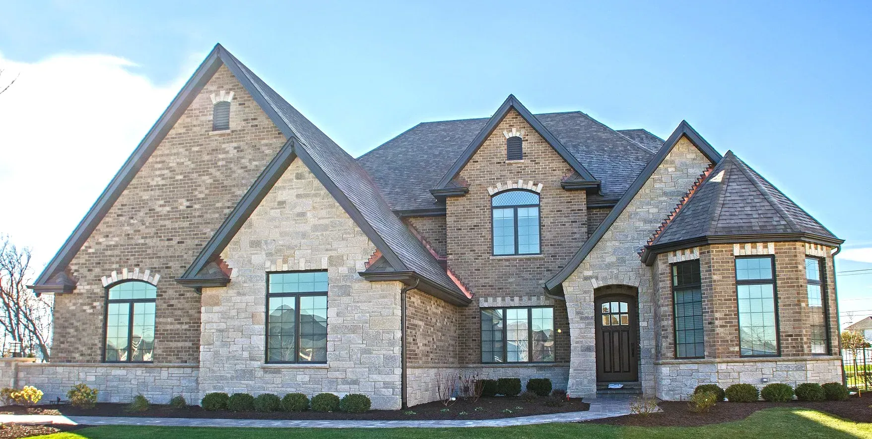 A large brick house with a lot of windows