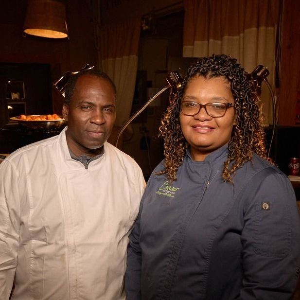 A man and a woman are posing for a picture together