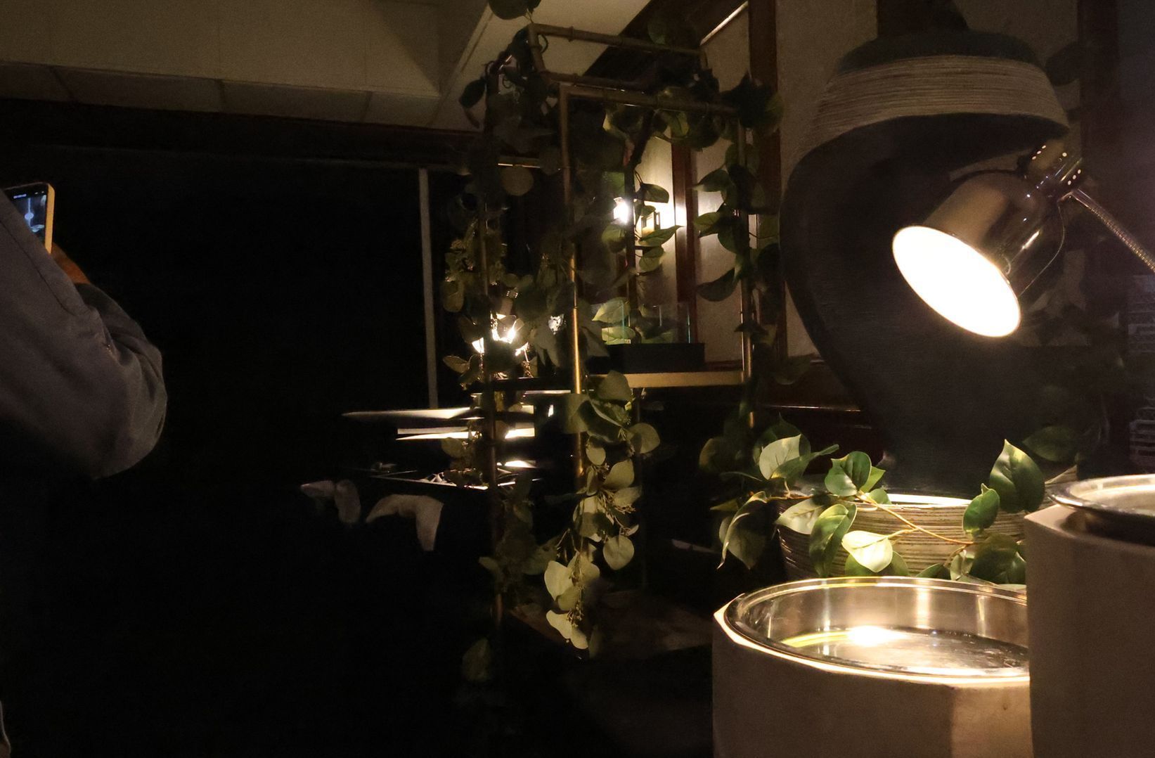 A lamp is lit up in a dark room