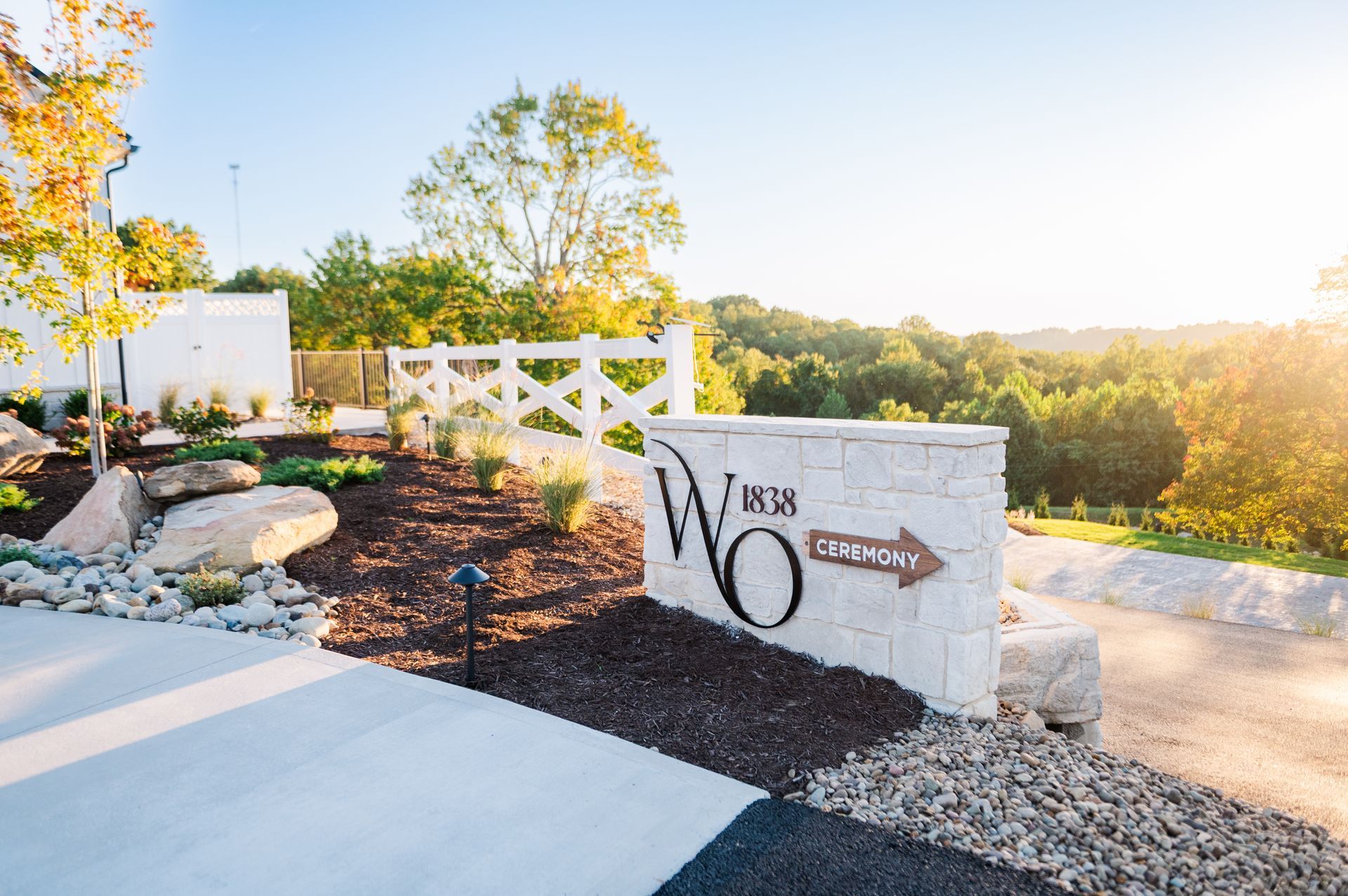 Rustic wooden cabinet with drawers and wheel on a shiny floor.