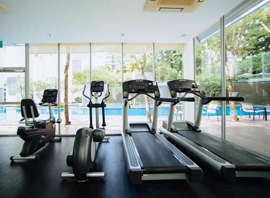 a gym with treadmills , exercise bikes , and a swimming pool .