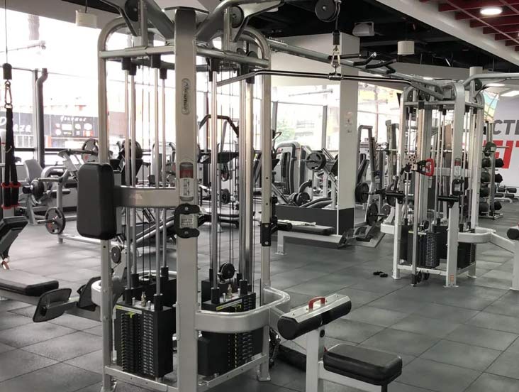 a gym with a sign that says ' fitness ' on it