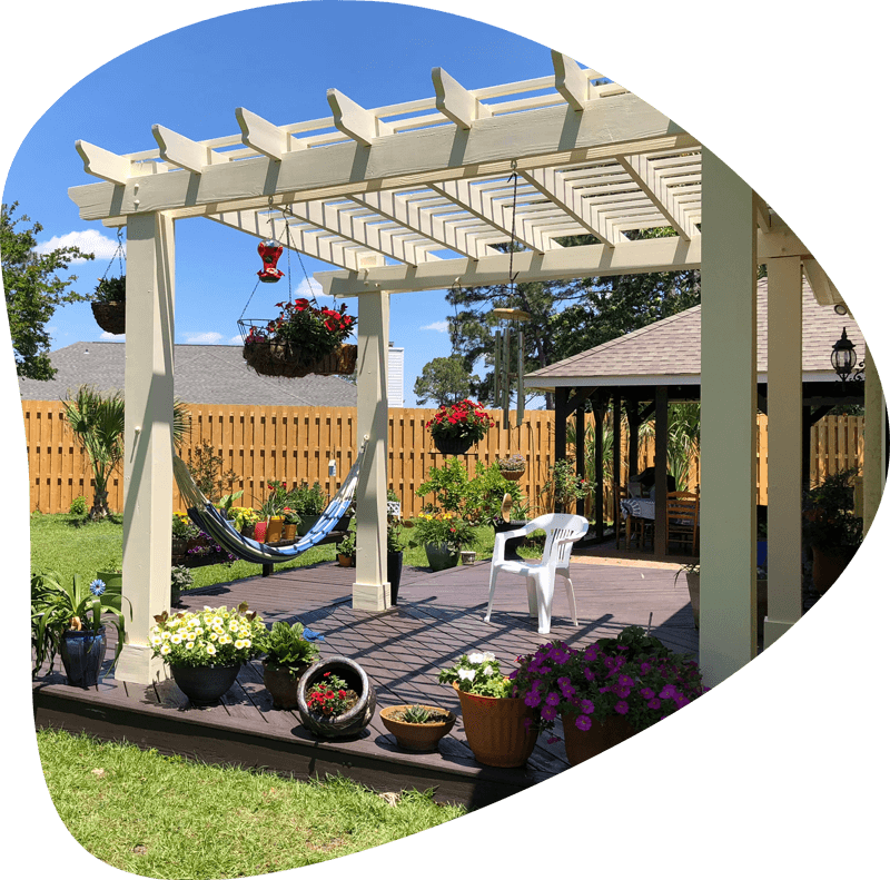 backyard oasis with a shadow box fence and pergola