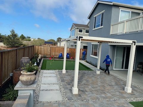 A house with a pergola and a pool in the backyard.