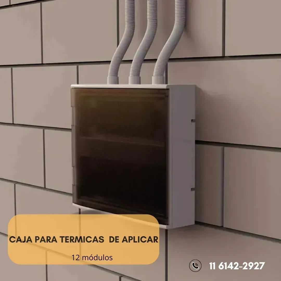 Gray electrical box on a brick wall with three white conduit pipes. Text: 